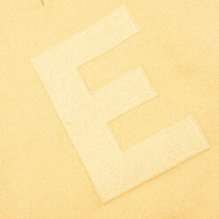 Kid's Knit Polo - Light Tuscan 8 Kid's Knit Polo - Light Tuscan -Feature Clothing Fear Of God Essentials Kid s Knit Polo Light Tuscan 785BT222332K 06 06 23 Feature VR 4