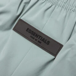 Kid's Running Short - Sycamore 8 Kid's Running Short - Sycamore -Feature Clothing Fear Of God Essentials Kid s Running Short Sycamore 785BT224121K 06 08 23 Feature MG 5