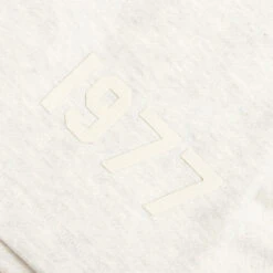 Essentials Kid's Shorts - Light Oatmeal 9 Essentials Kid's Shorts - Light Oatmeal -Feature Clothing Fear of God Essentials Kids Shorts Light Oatmeal 785BT214402K 11 23 22 Feature NF 44