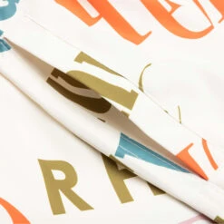 Rhude Mash-Up Logo Swim Trunks - Creme/Multi -Feature Clothing Rhude Mash Up Logo Swim Trunks Creme Multi RHPS23SH098345670567 07 27 23 Feature KN 6