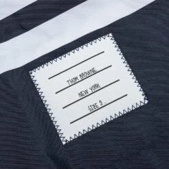 4-Bar Board Short - Navy -Feature Clothing Thom Browne Board Short with Drawstring Waist and 4Bar in Swim Tech Navy MTT029A 07538 415 06 14 22 Feature JP 8